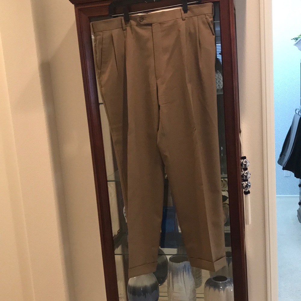 Cuffed tan slacks by Jos A Banks
